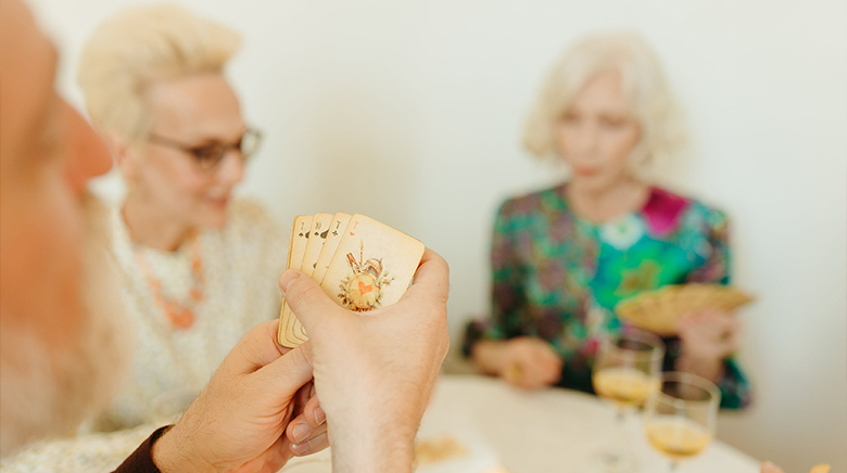 residents sat together playing cards
