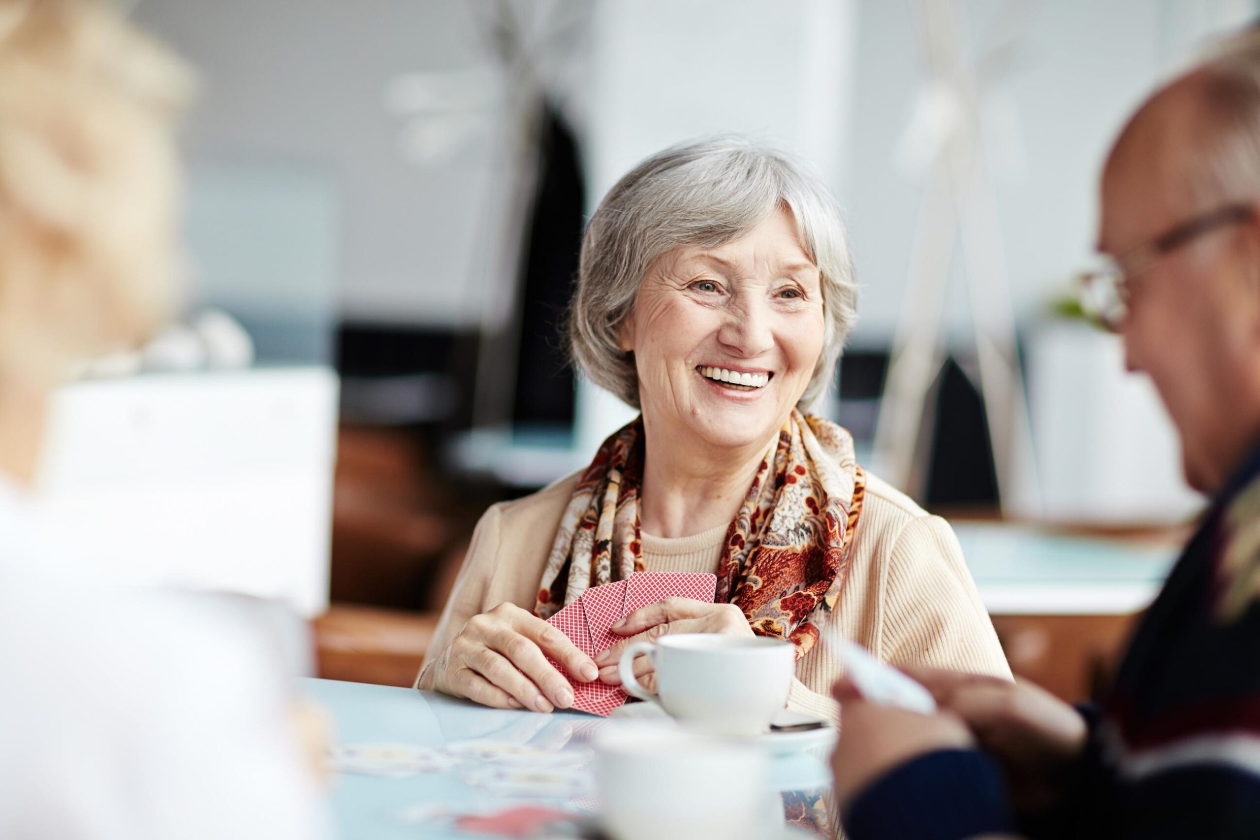 resident-smiling-whilst-playing-cards