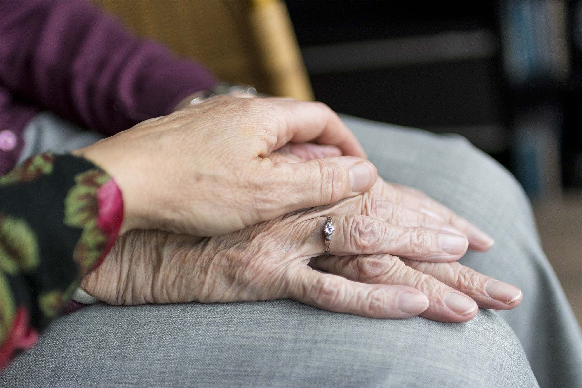 hands laying on top of each other