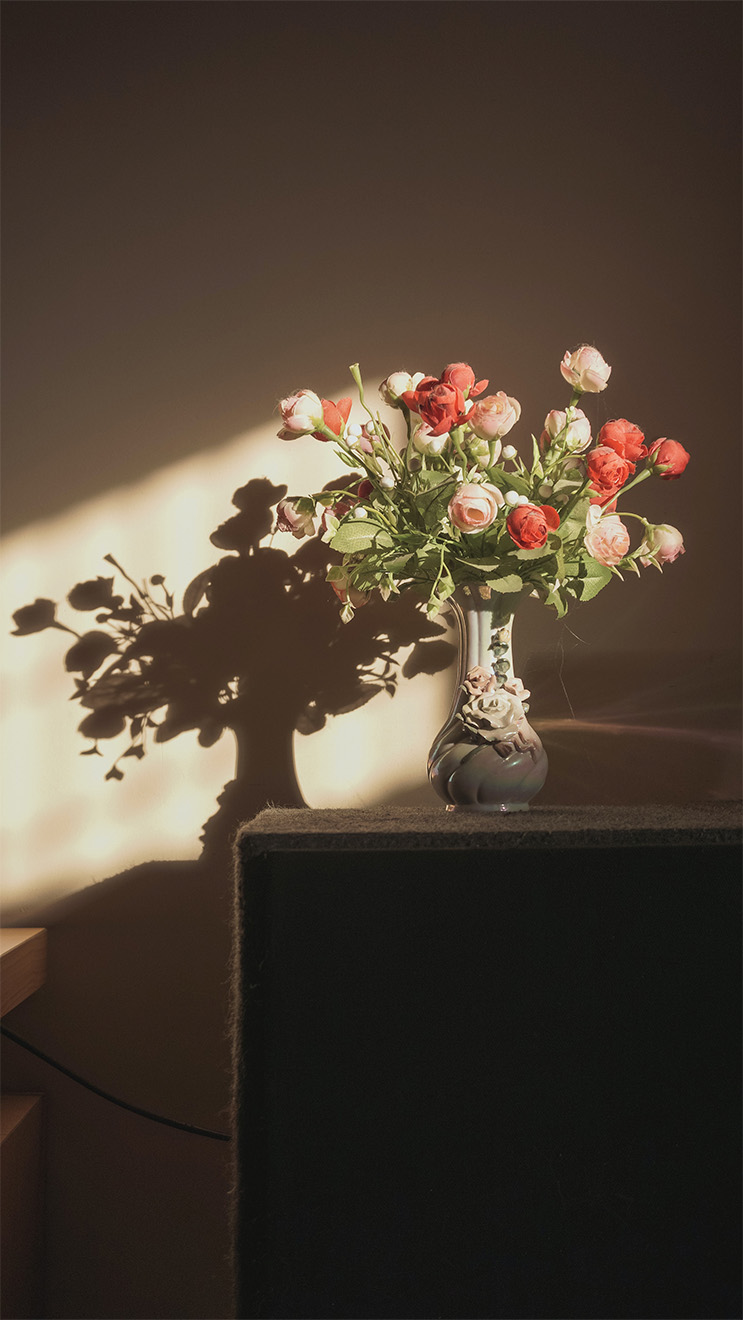 a bunch of flowers in a vase on the table