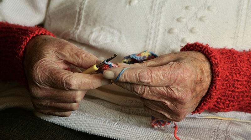 older woman sewing
